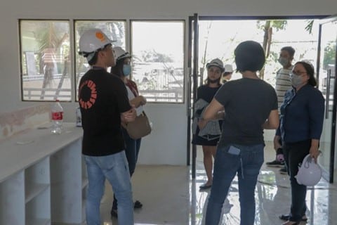 Inspection of one of the laboratories under construction, Integrated Building for COM