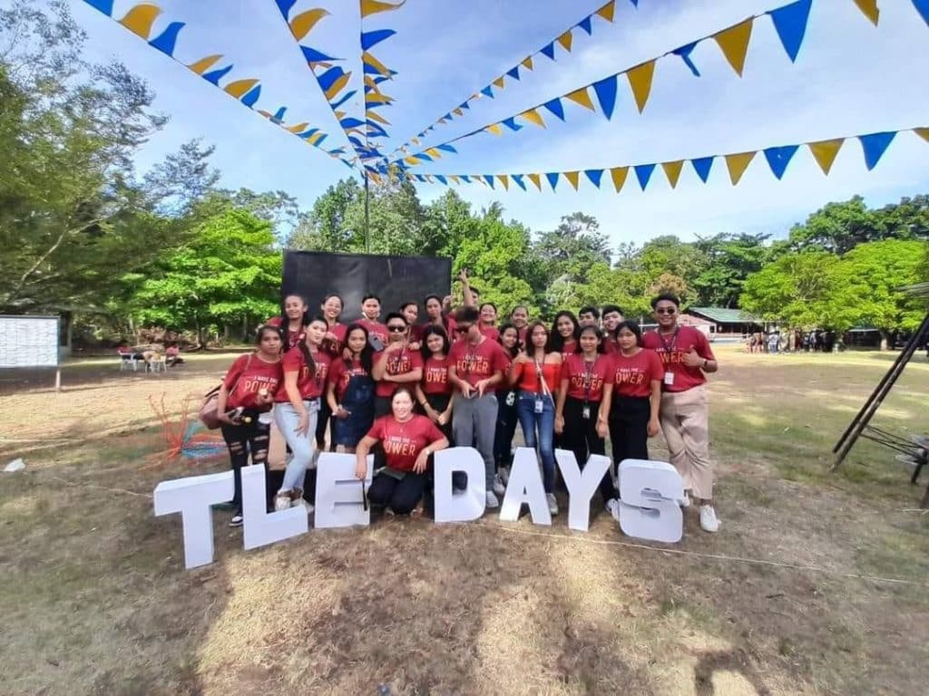 DTLEd Students pose on the field