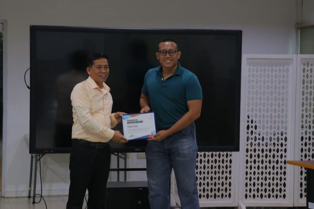 Dr. Cultura presenting the certificate of appreciation to Mr. Udani