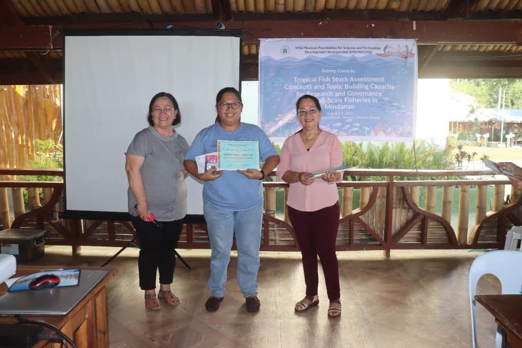 Ms. Marjho Mae S. Cardoza receives her certificate of participation